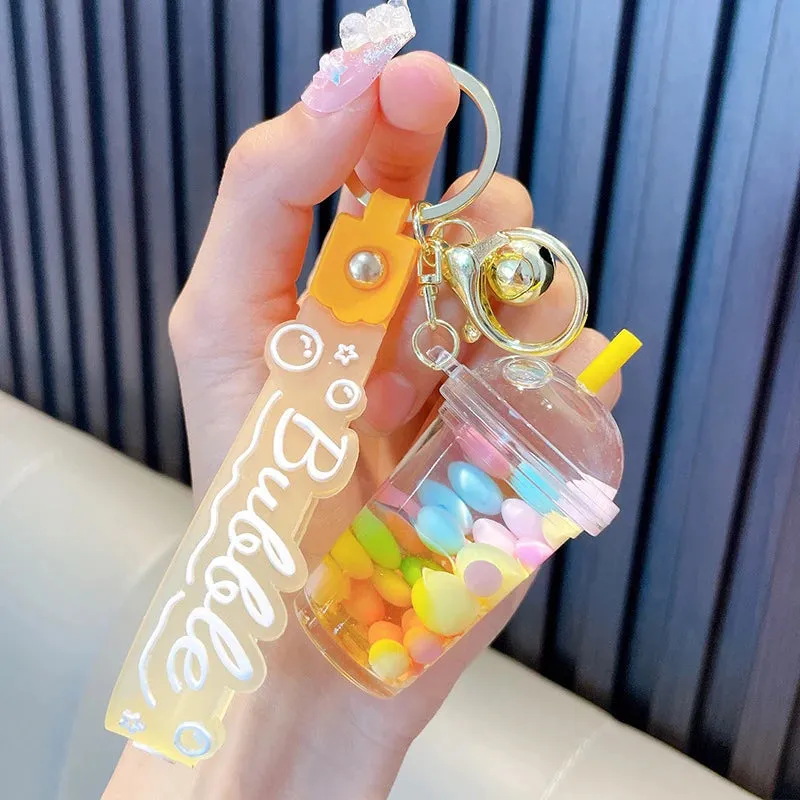 ✨ Adorable Quicksand Jelly Bean Keychain 🌈 - Whimsical Liquid Pearl Milk Tea Pendant for Trendy Bags & Keys! 🎀