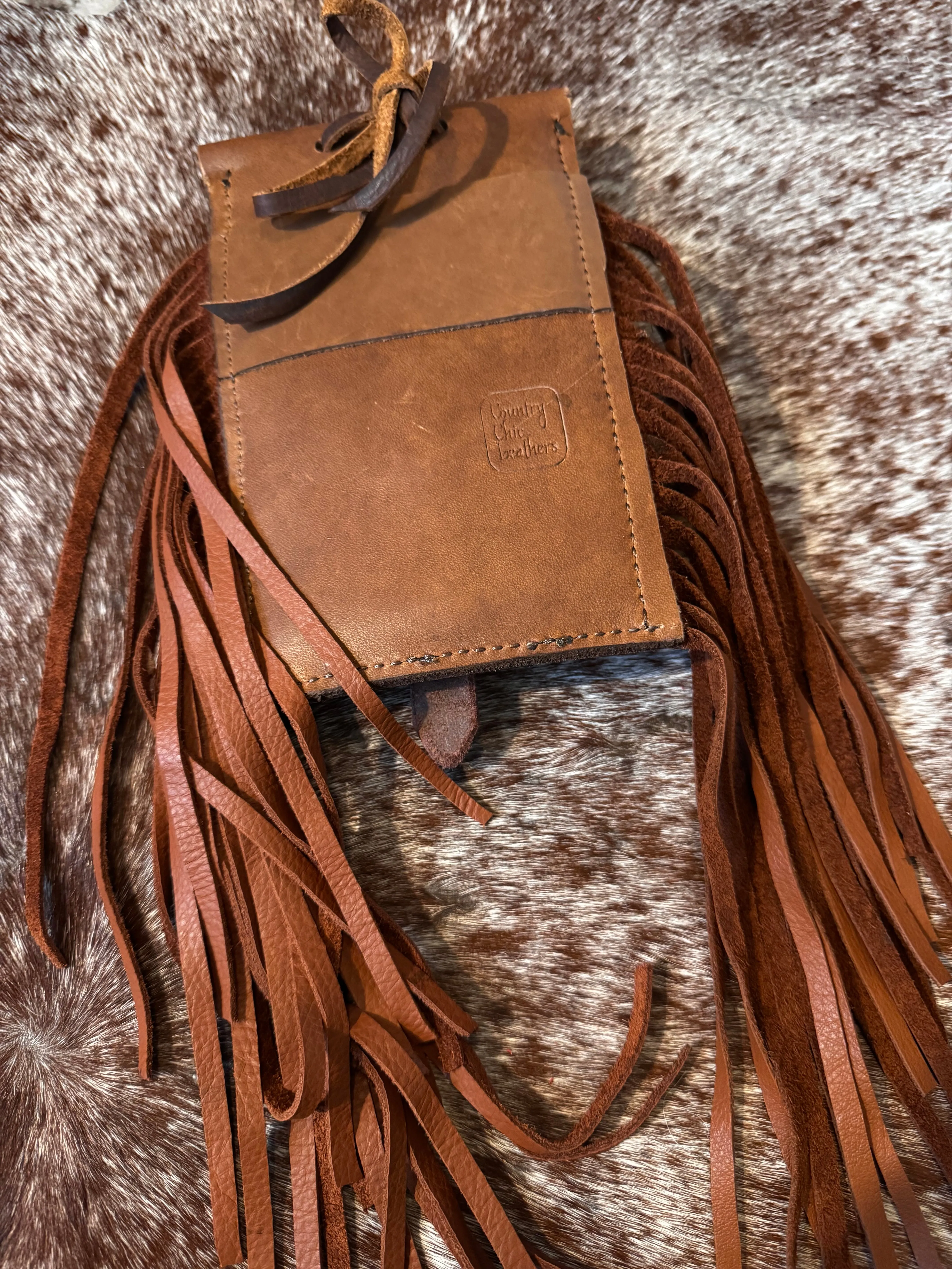 Back cinch saddle cell phone holder