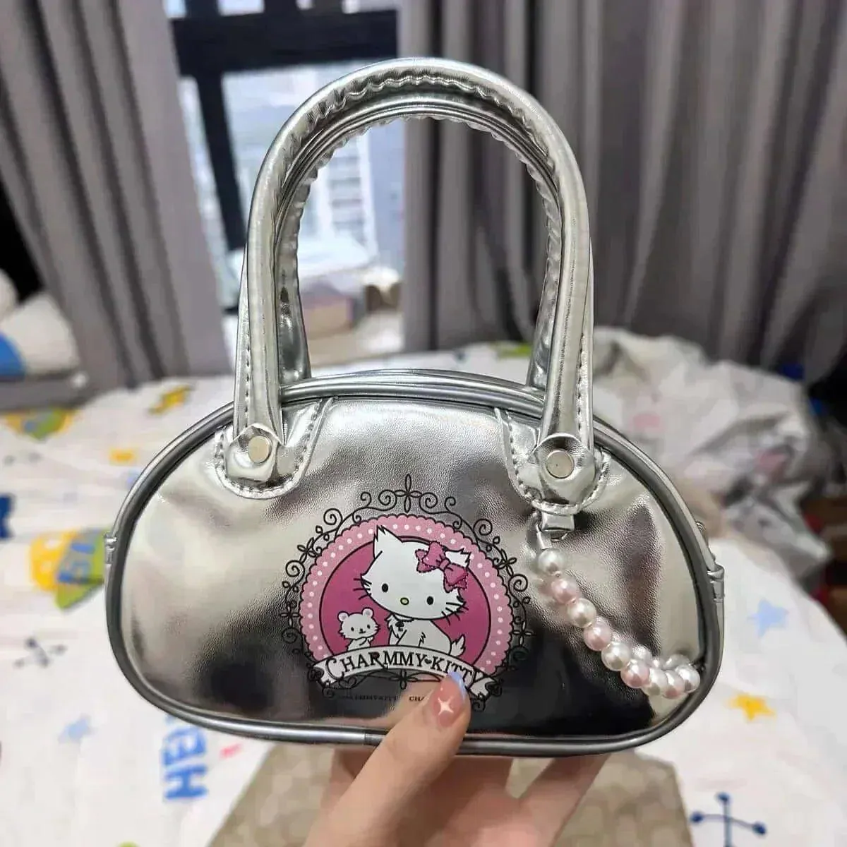 Charmmy Kitty Hand Bag with a shoulder strap