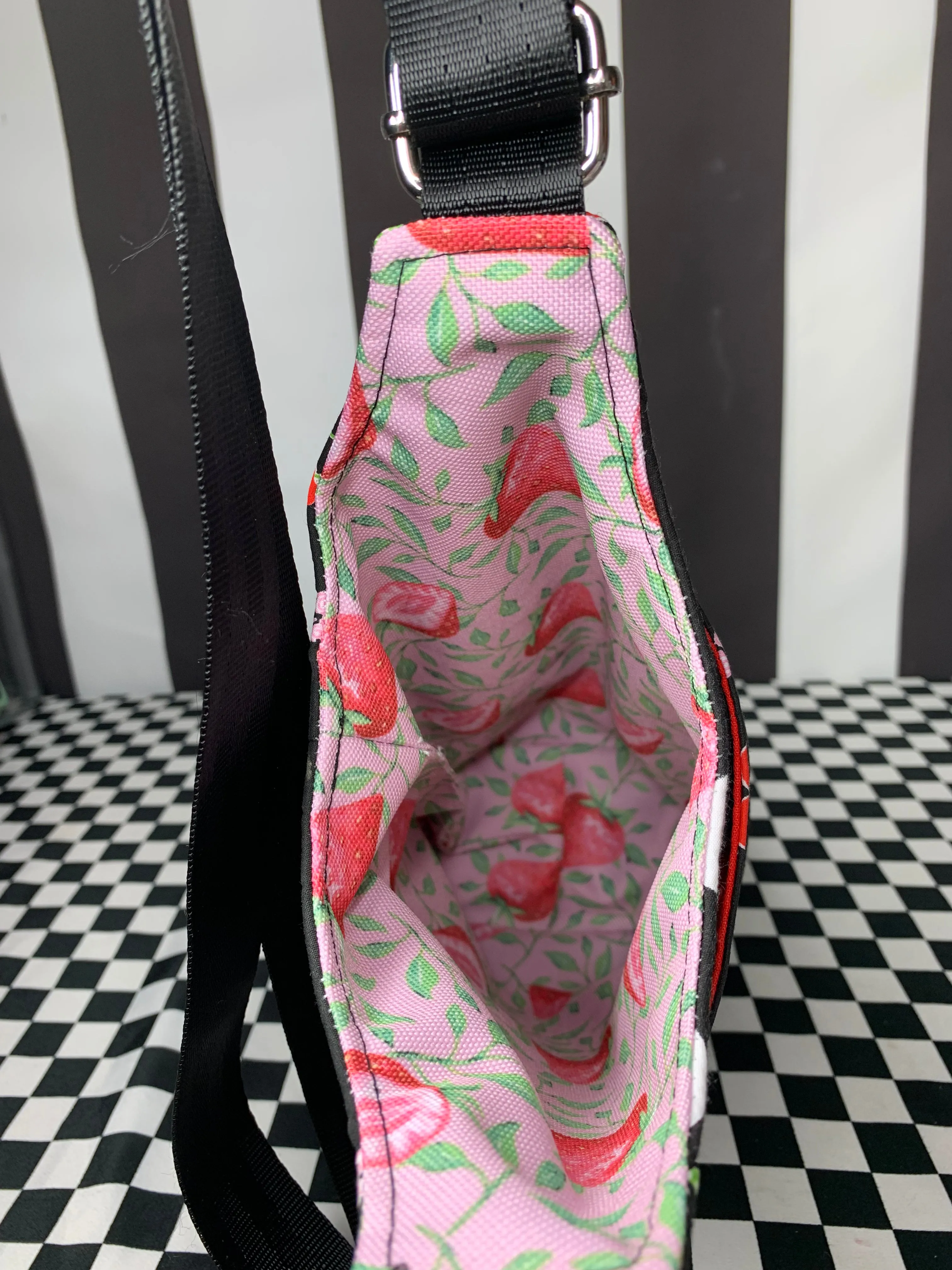 Cherries on black print drink bottle crossbody bag