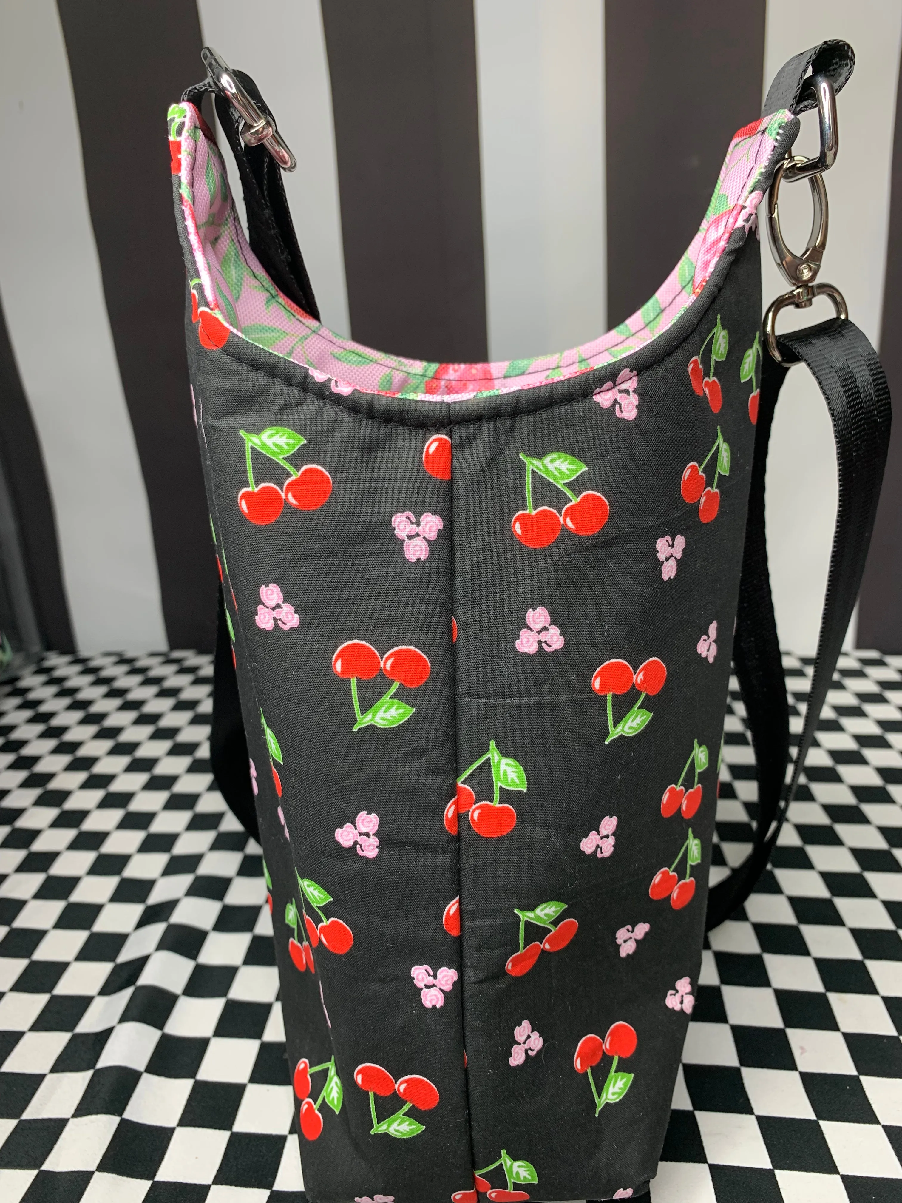 Cherries on black print drink bottle crossbody bag