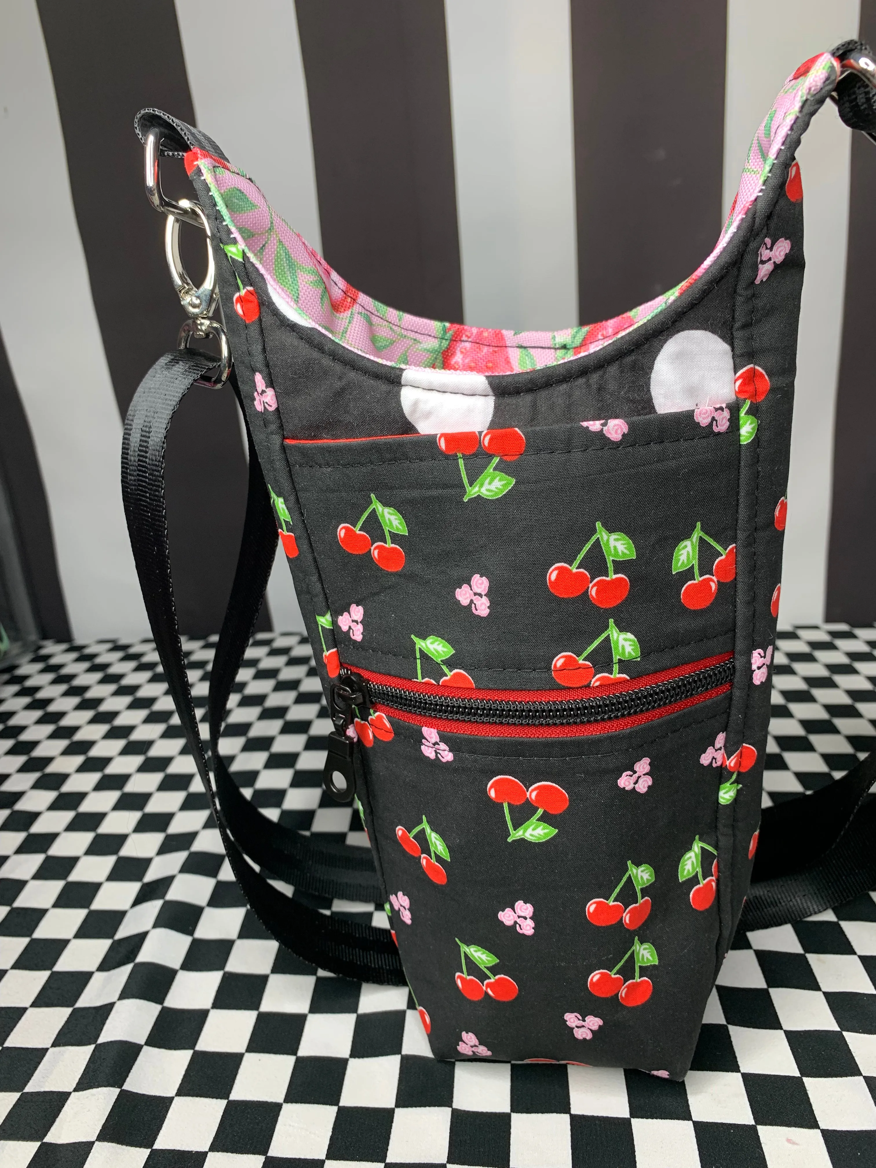 Cherries on black print drink bottle crossbody bag