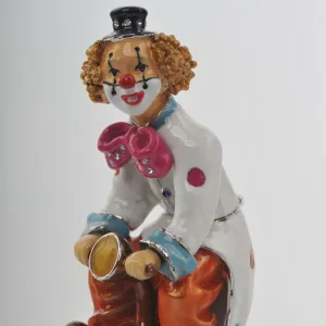 Happy Circus Clown on Unicycle