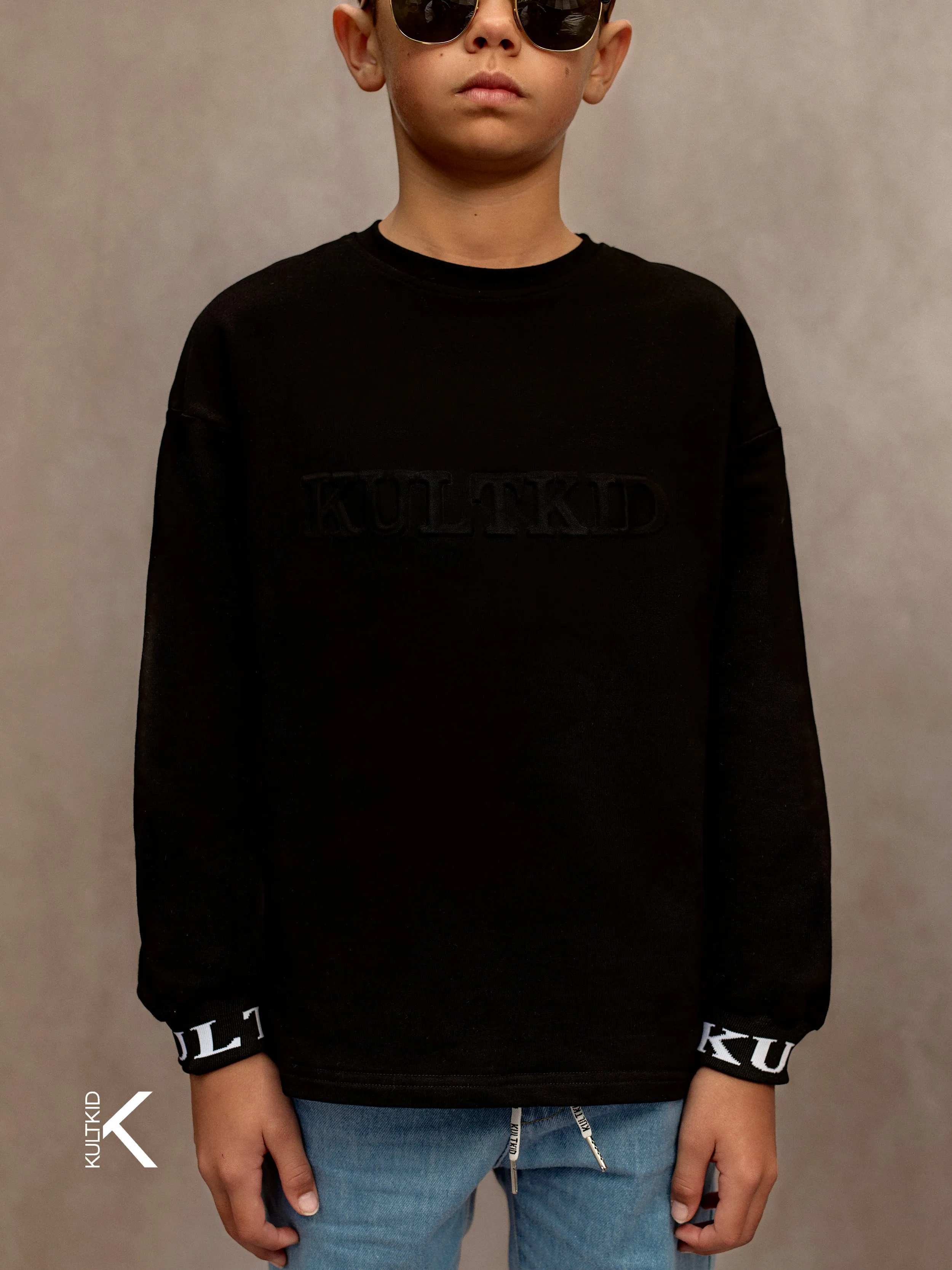 Oversized Logo Embossed Jumper in Space Black