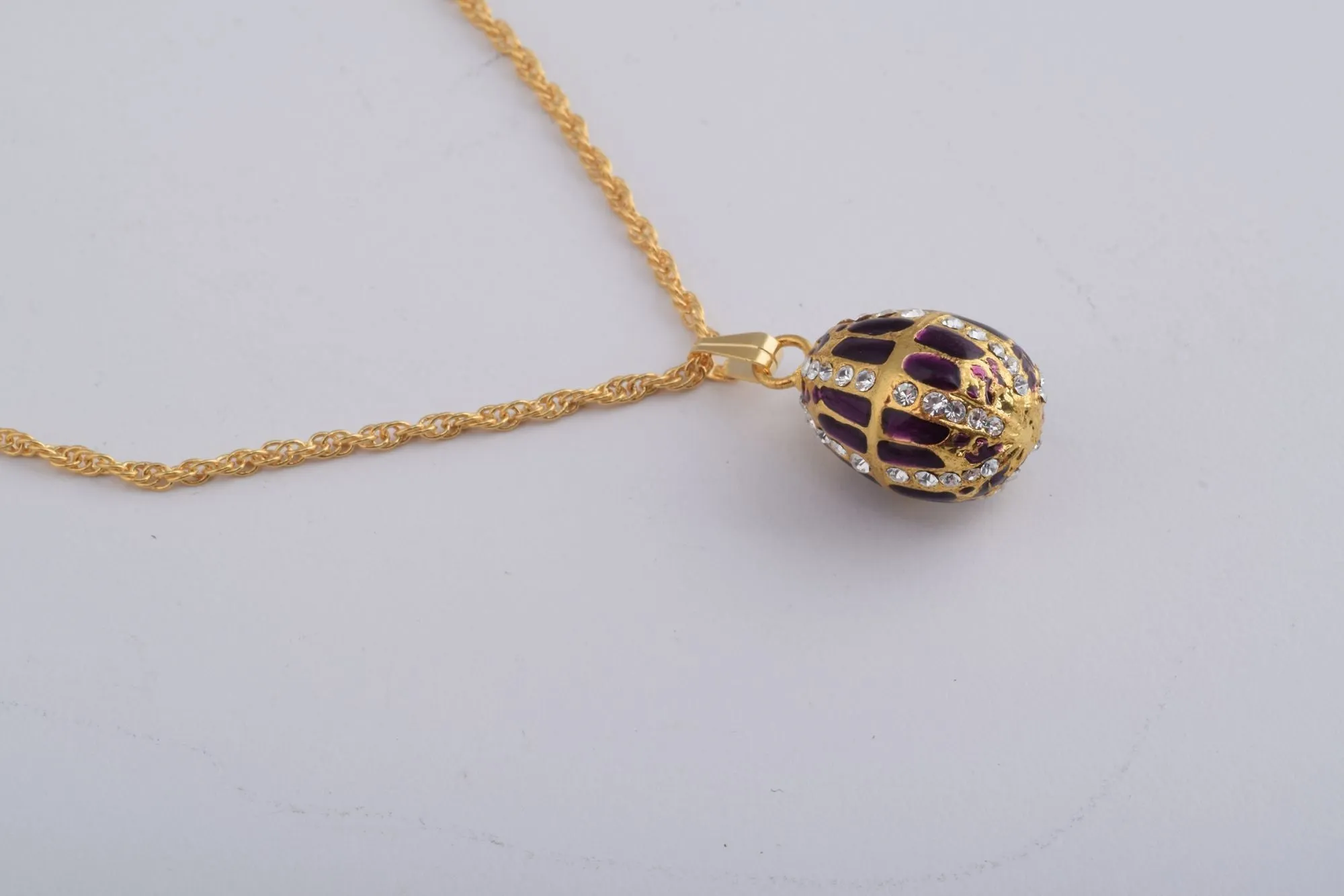 Purple Faberge Style Egg with an Egg Pendant Inside