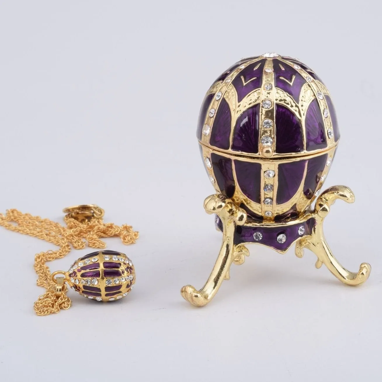Purple Faberge Style Egg with an Egg Pendant Inside